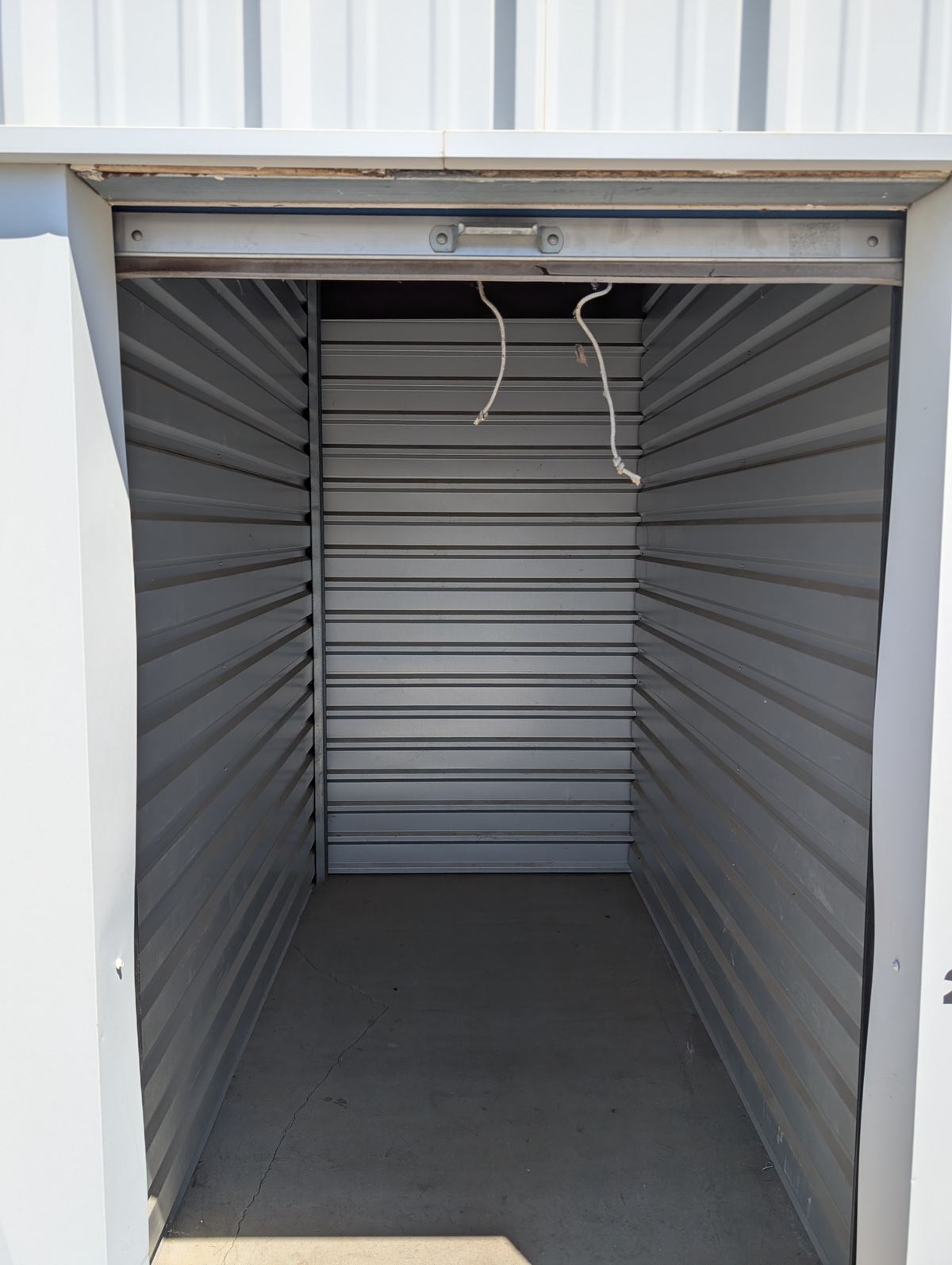 Inside an empty storage unit, clean and ready to fill